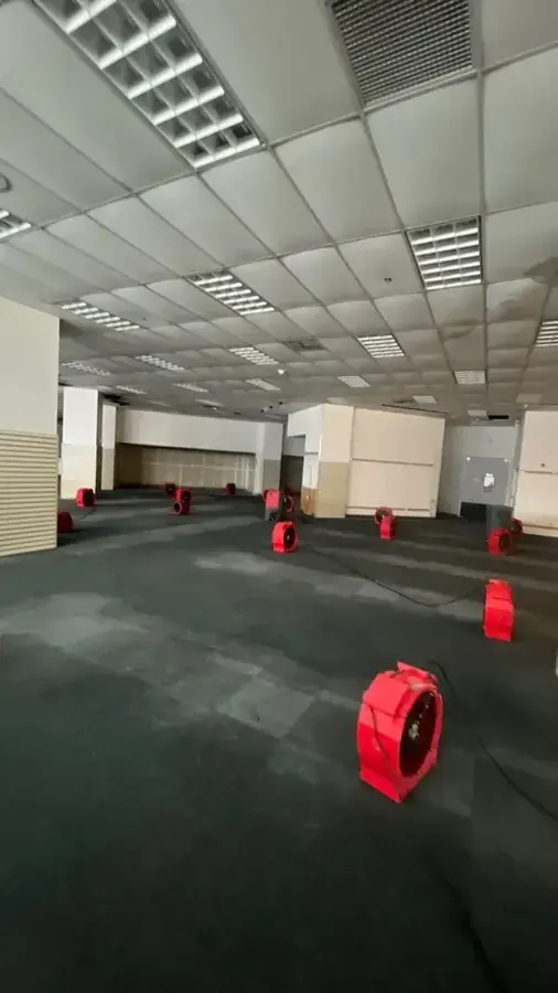 Air movers drying a great room after a leak in a northeast Valley home